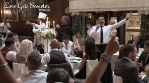 A wedding video still of The singing waiters from Encore entertainment perform as a surprise for both the bride and the wedding guests at this Thornton Manor wedding