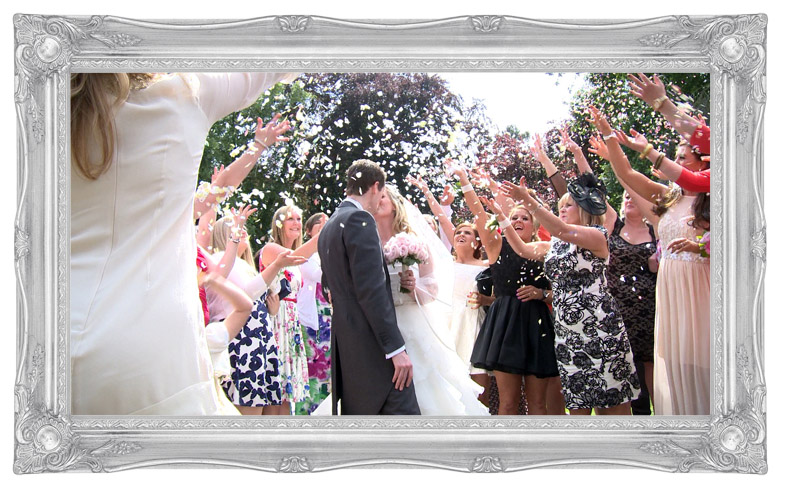 a still from the wedding video of the Bride and Groom bright pink confetti shot Deanwater Hotel Manchester Stockport Cheshire wedding