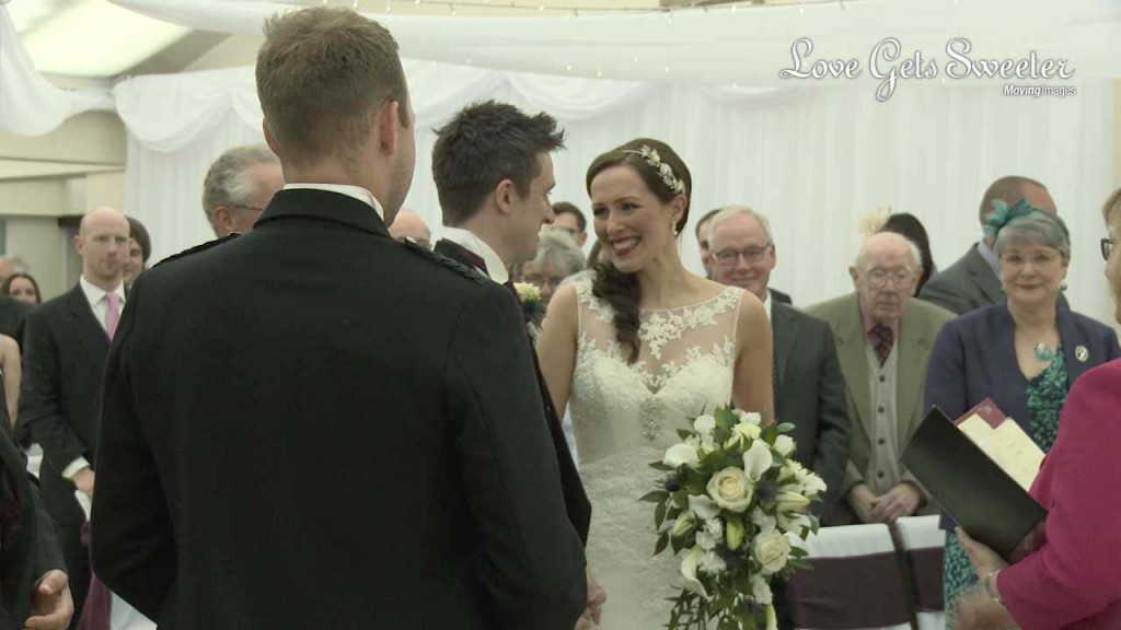 A bride shows her emotions as she arrives to be beside her handsome groom during their wedding ceremony at Mere Court Hotel in Cheshire