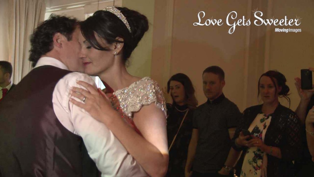 A romantic first dance at the west tower is filmed by their wedding videographer Love Gets Sweeter. She leans against her groom with her eyes closed