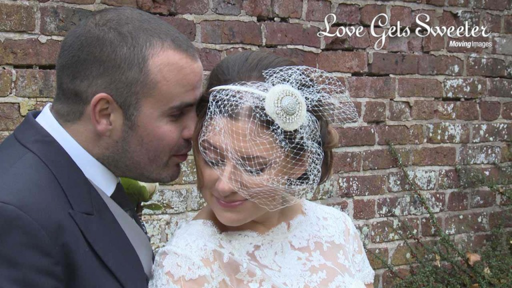 a wedding still showing off Rebecca's incredible vintage birdcage veil she wore on her wedding day at Soughton Hall