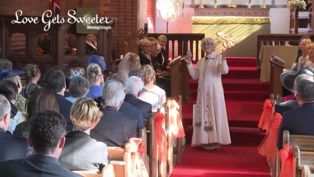 the female priest at St Johns in High Legh Cheshire with a full crowd in the church as she delivers her sermon with a smile