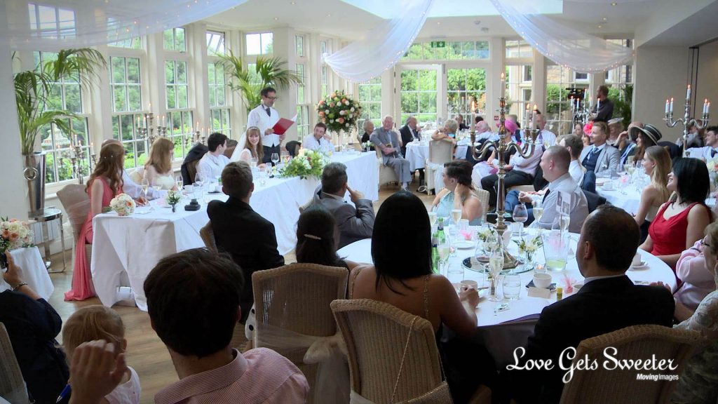 mitton hall wedding venue in clitheroe lancashire white and light reception room filled with guests listening to the father of the bride make his speech
