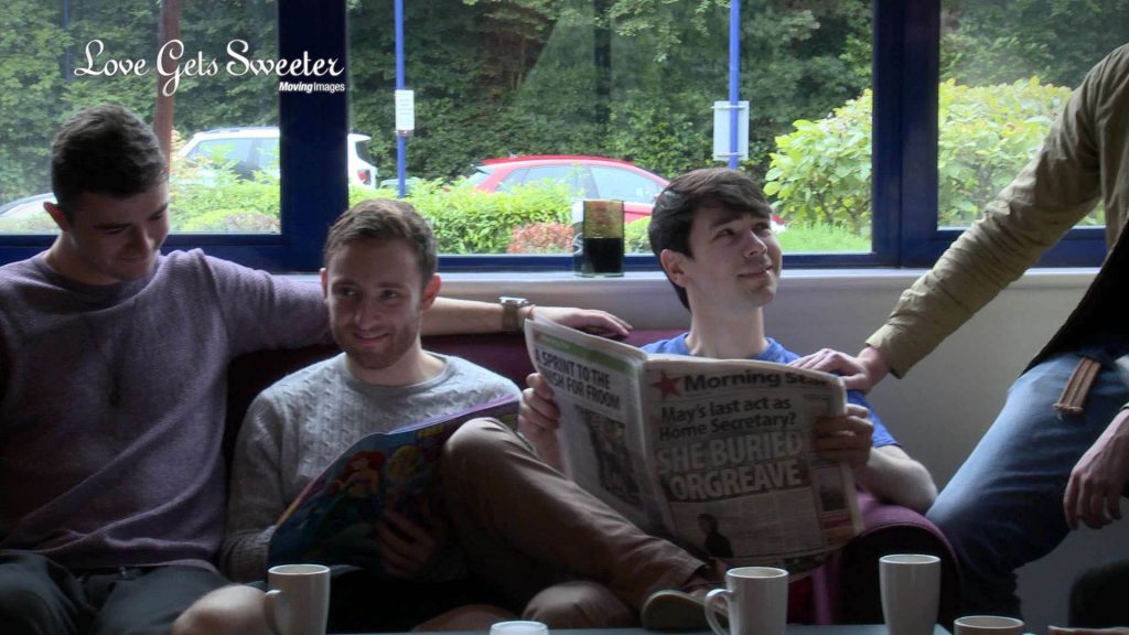 A frame taken from the wedding video showing the Groom, his Best man and ushers enjoying a coffee and reading the morning paper before the wedding at St Johns Church in Broughton near Preston