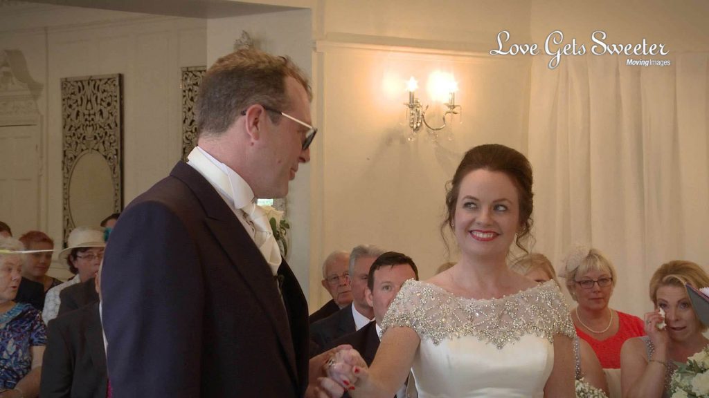 happy bride and groom during wedding ceremony at Eaves Hall