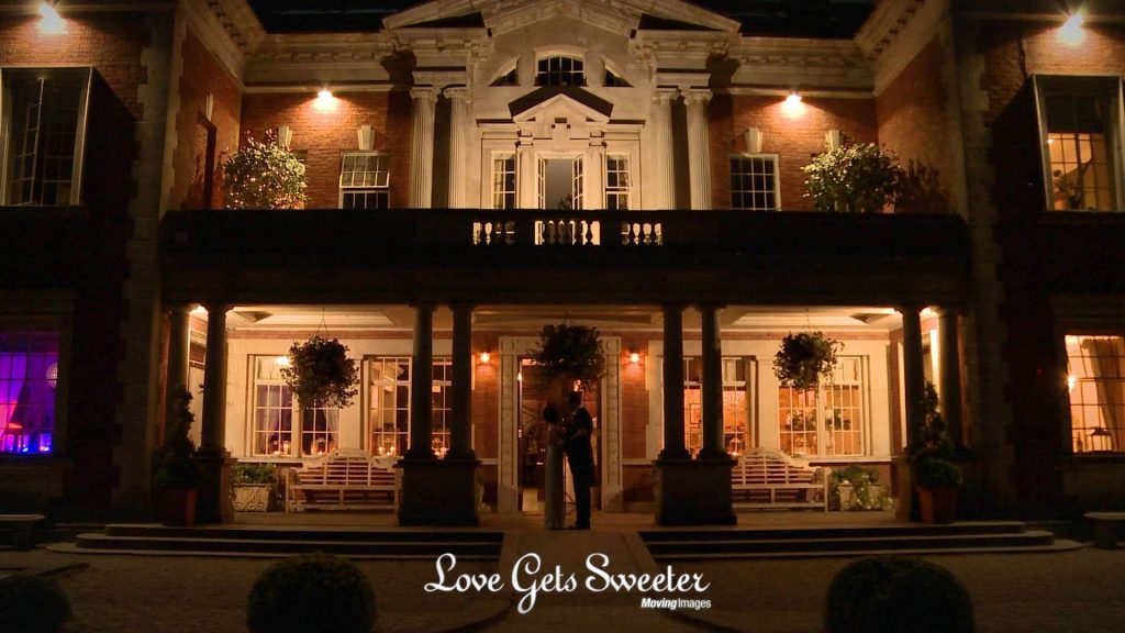 bride and groom silhouette outside Eaves Hall at night