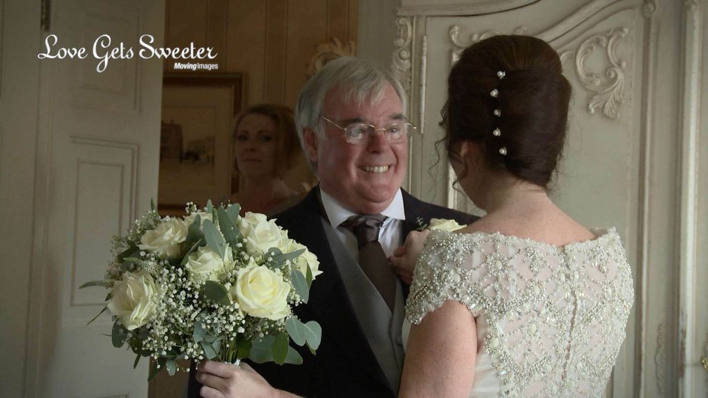 dad seeing daughter dressed as a bride filming at eaves hall