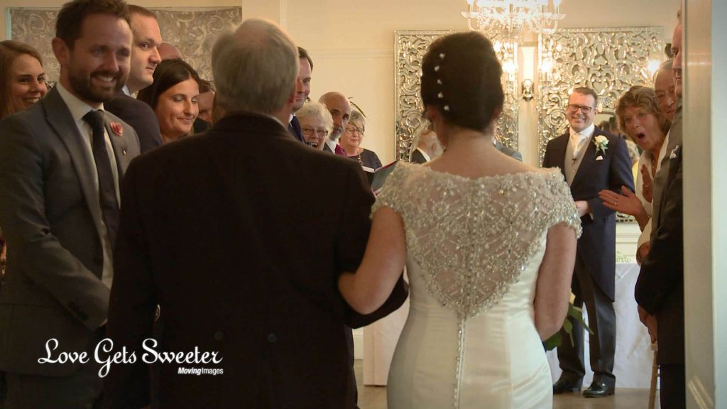 wedding video of bride walking down aisle at Eaves Hall