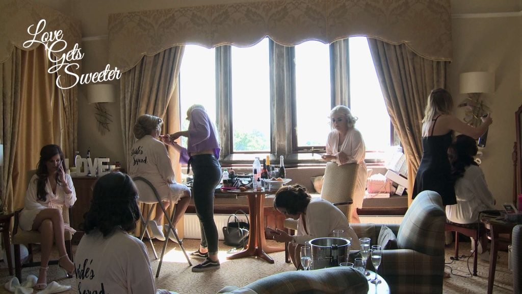 The bridal suite full of bridal party and the bride having their hair and make up done before the wedding at Armathwaite Hall