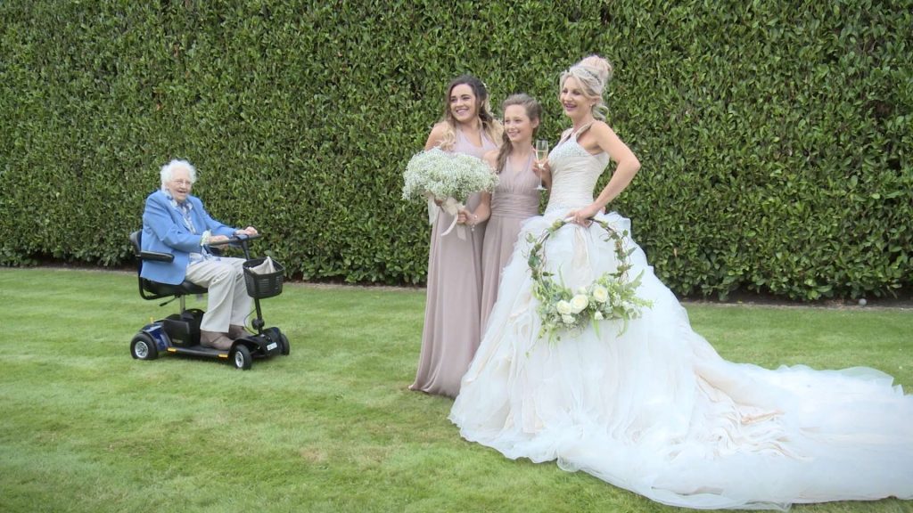 grandma photo bombs wedding photographs on her scooter