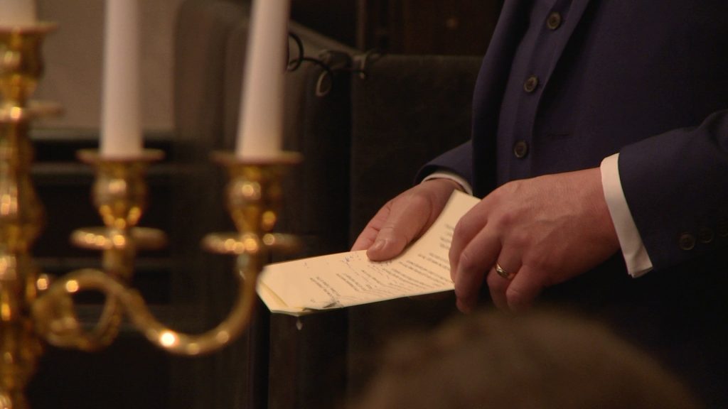 a close up in the wedding video of the father of the brides shaking hands holding his wedding speech at a wedding in The Bold Hotel in southport