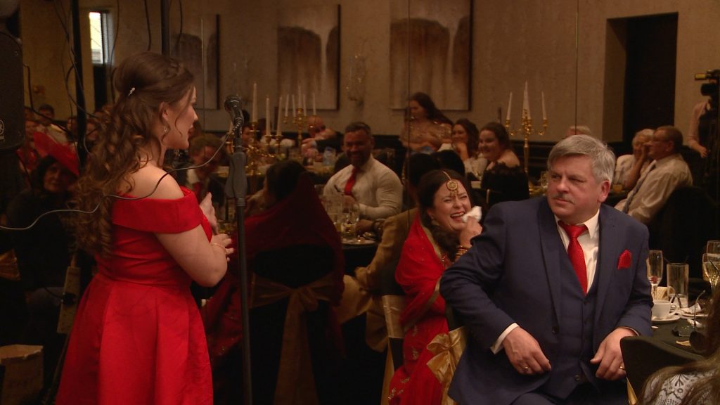 the maid of honour makes her sister laugh out loud during her wedding speech on the video