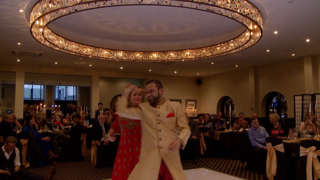 the bride twirls the groom round during their first dance at the bold hotel in southport
