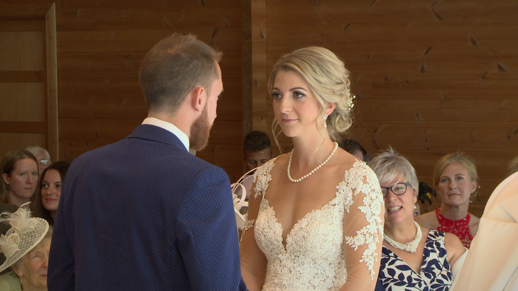 The bride and groom share their personal wedding vows with each other for the wedding video