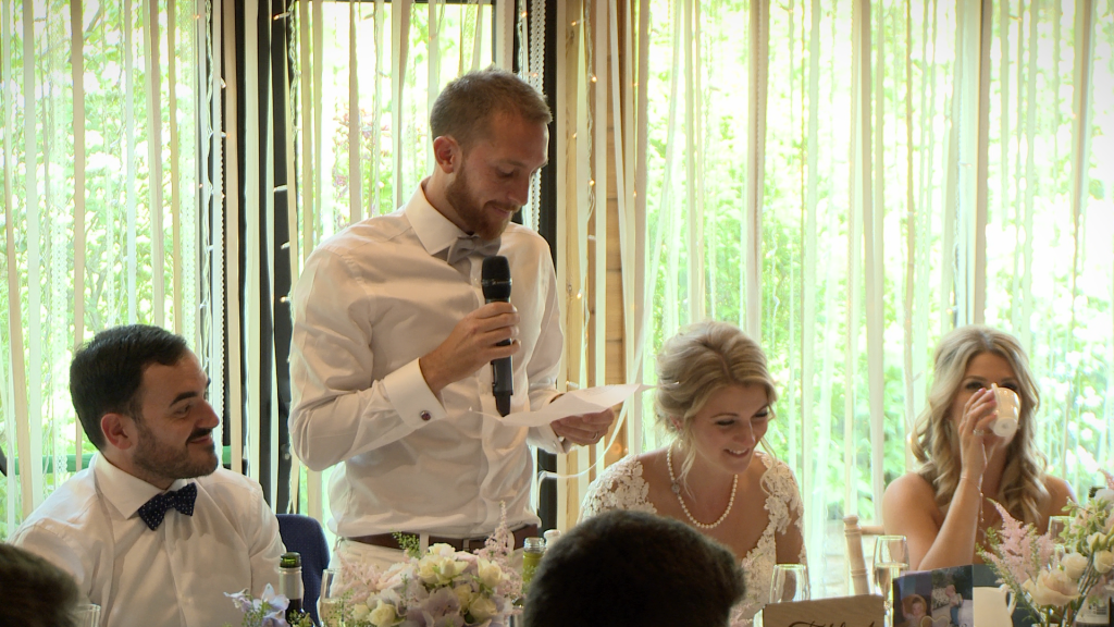 A wedding video still of the groom speaking from the heart about his new wife during their wedding speeches Styal Lodge in Cheshire