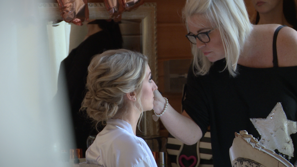 A video still of ruby slippers make up artist working on a Styal lodge bride in Cheshire