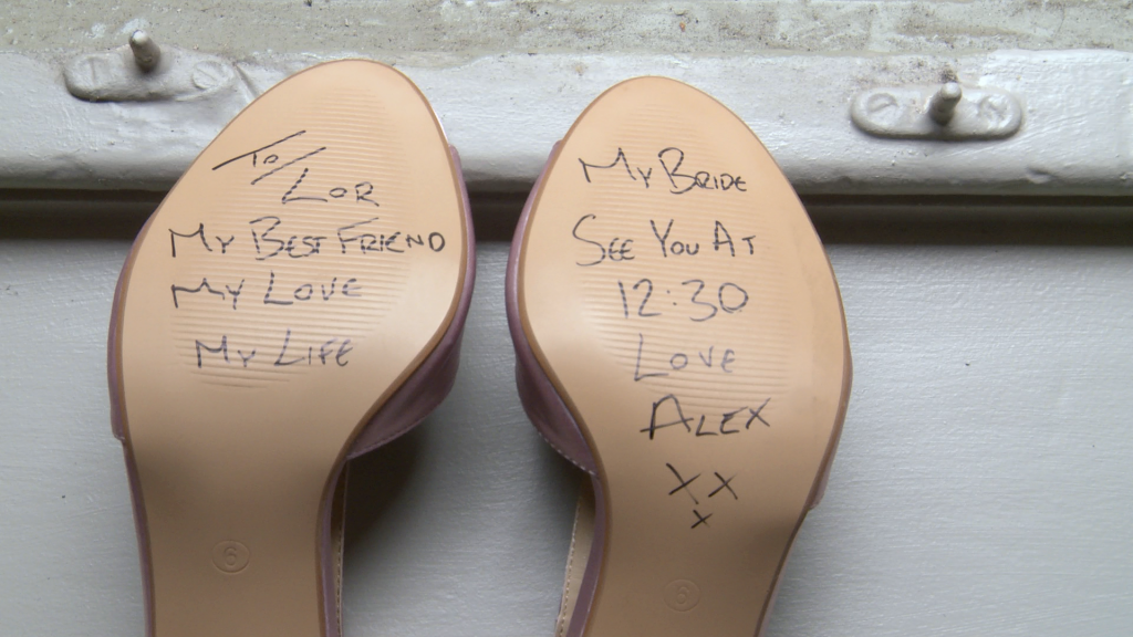 the groom writes a secret message on the bottom of his brides shoe saying to laura my best friend my love my life see you at 12:30 for their wedding at thornton manor