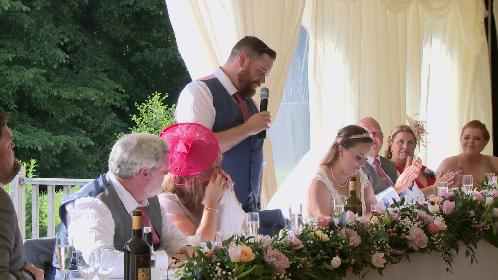 the groom says some lovely things about his new wife during their wedding reception