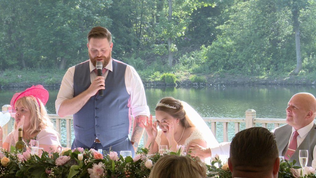 the bride wipes tears away during her grooms speech at thornton manor