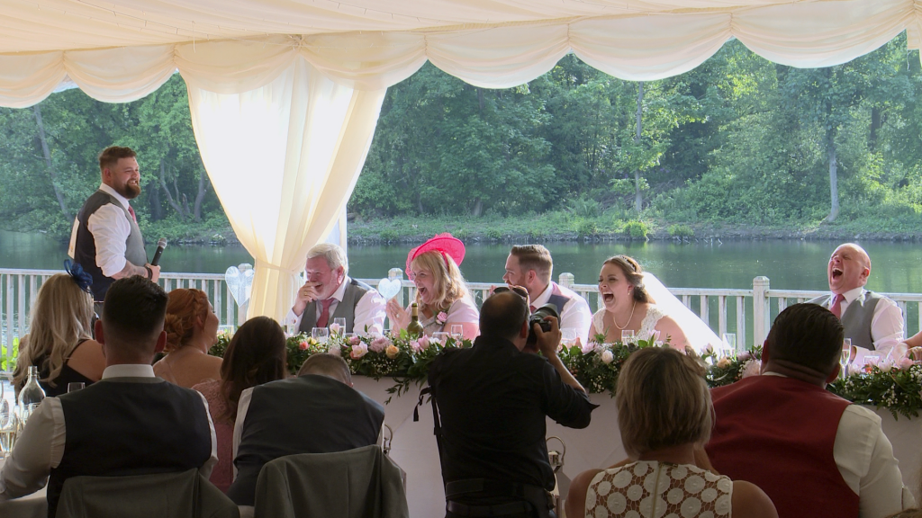 everyone laughs out loud at the sign on the back of the best man to play a joke on the father of the bride about swearing