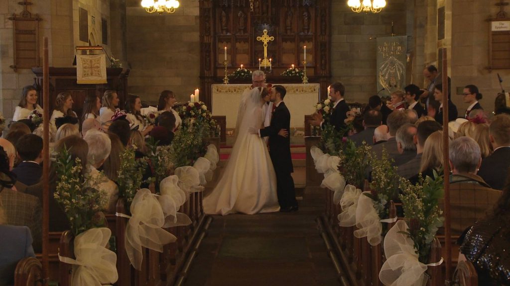 the you may kiss the bride moment inside broughton church from the wedding video