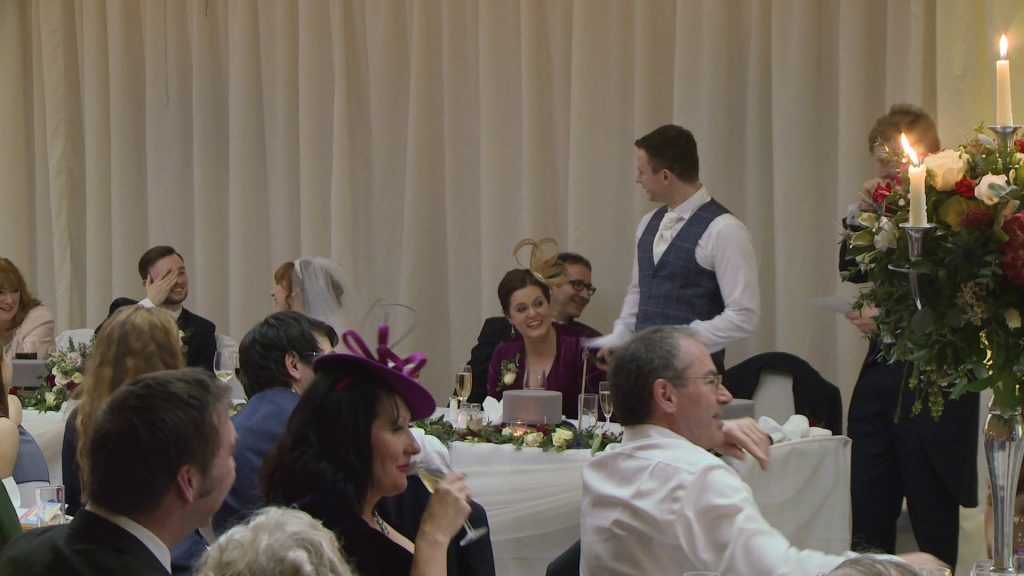 a wedding video still of the groom hiding his face during an embarrassing best man's speech at the villa wrea green near preston