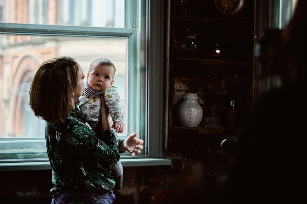 a mum and her baby boy pose for a family photography workshop in manchester with Anna Hardy