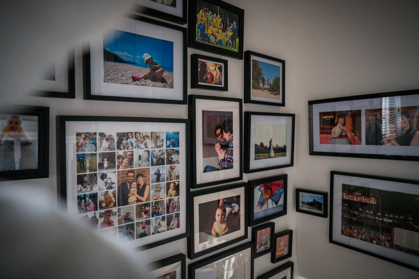 a photo of a family gallery wall showcasing how to make the most of printing family photos