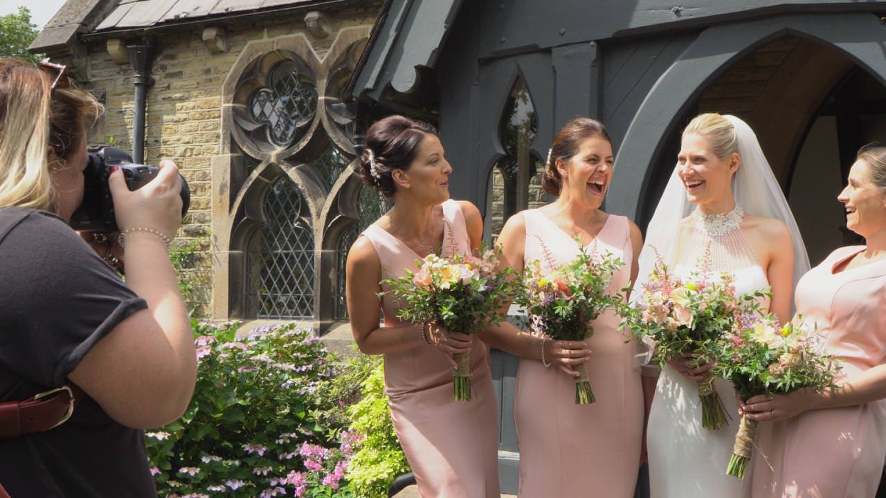bridesmaids laugh at the bride during wedding photos with Sarah Maria Photography