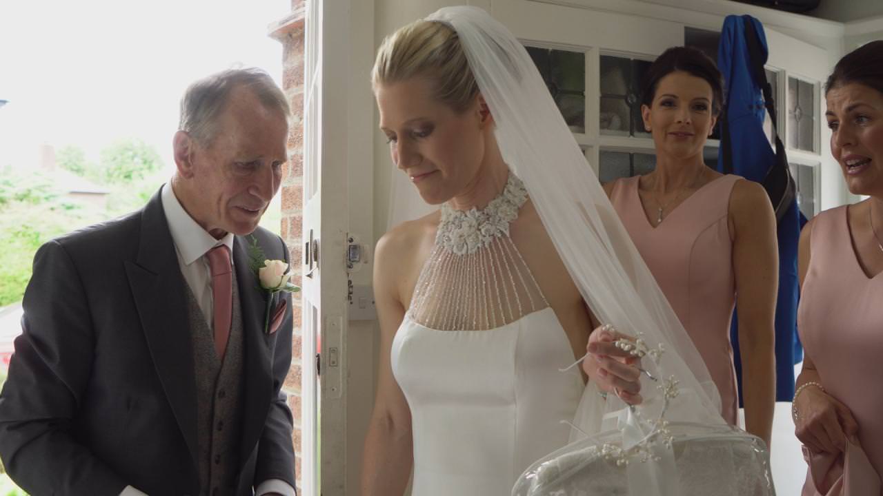 a bride gets ready to leave for the church with her dad in Hale Cheshire