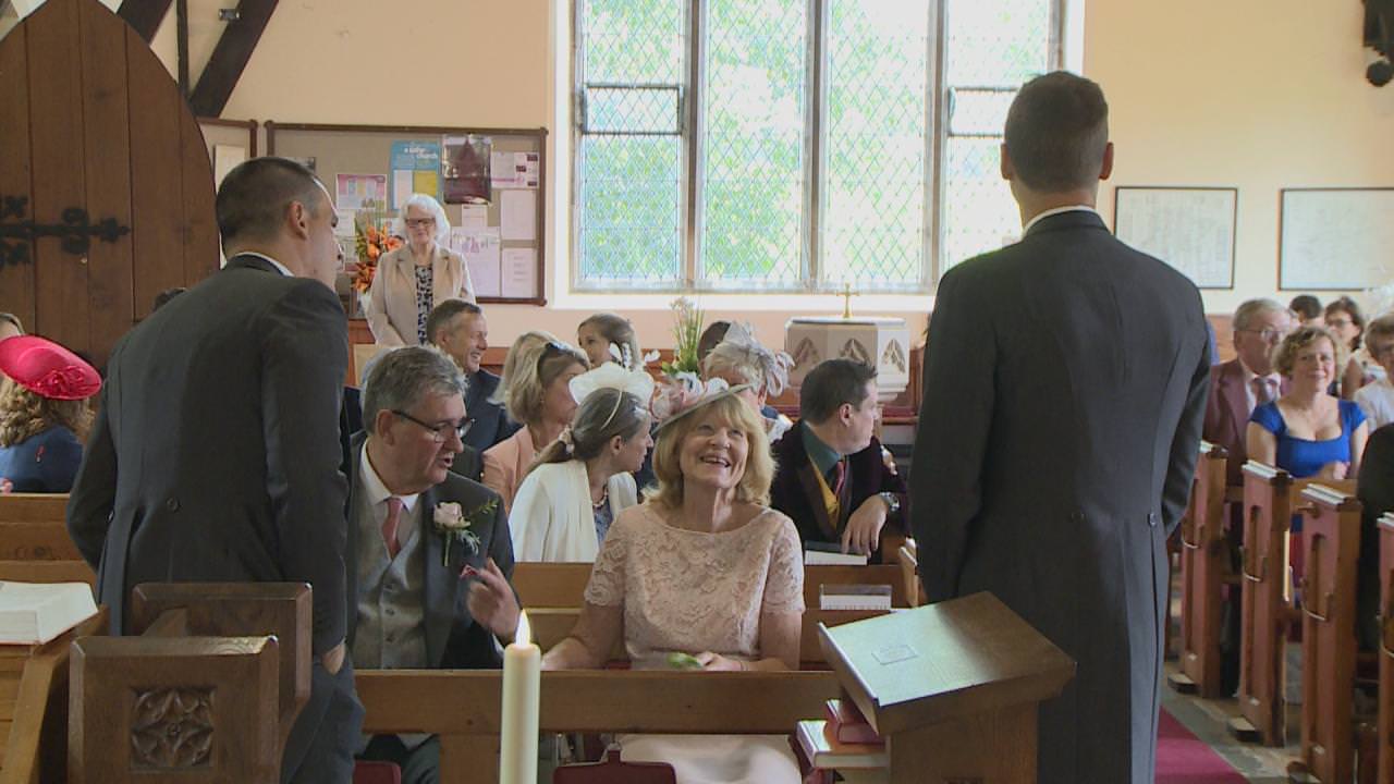 a groom waits nervously at St Marks Church in Cheshire
