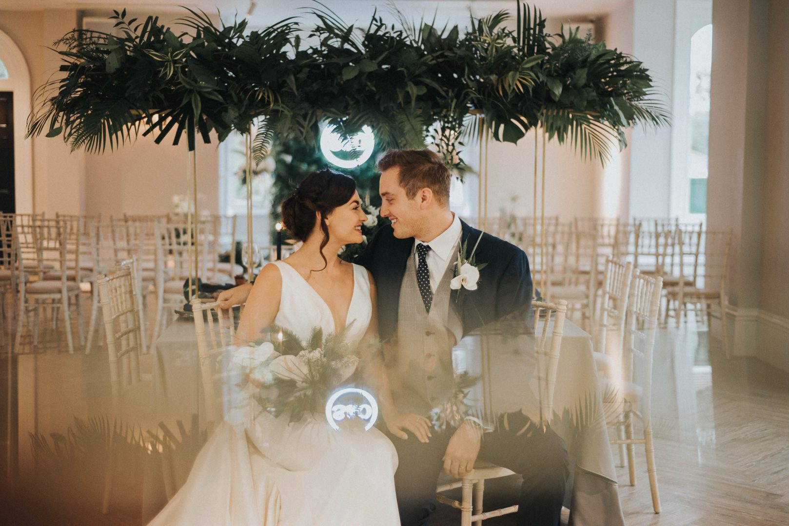 a bride and groom sit in the ceremony room at Albert's Standish near Wigan