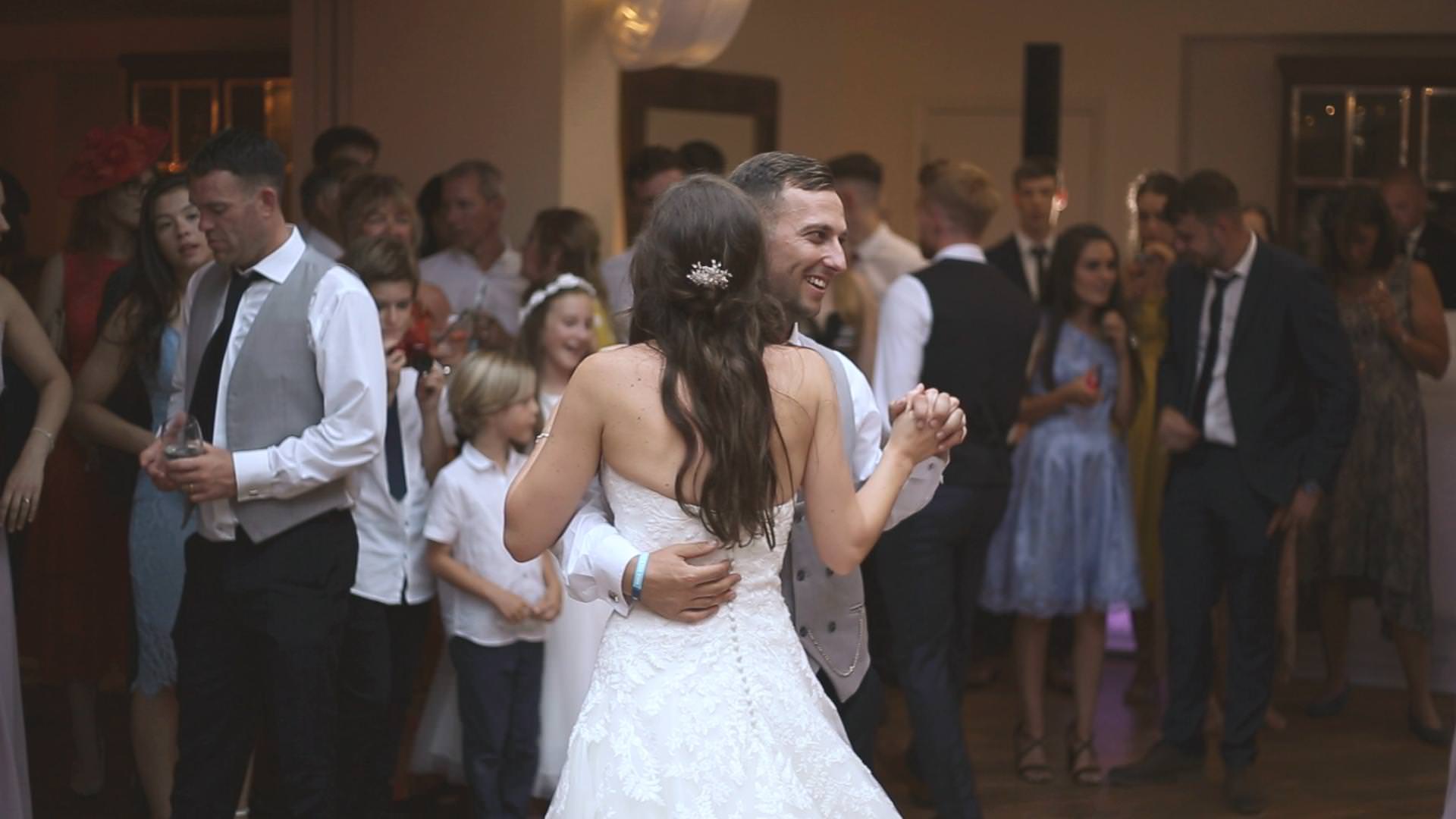 the bride and groom enjoy their first dance at mitton hall