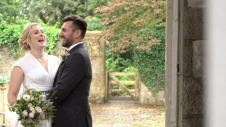 bride and groom laugh during video and photo couple portraits