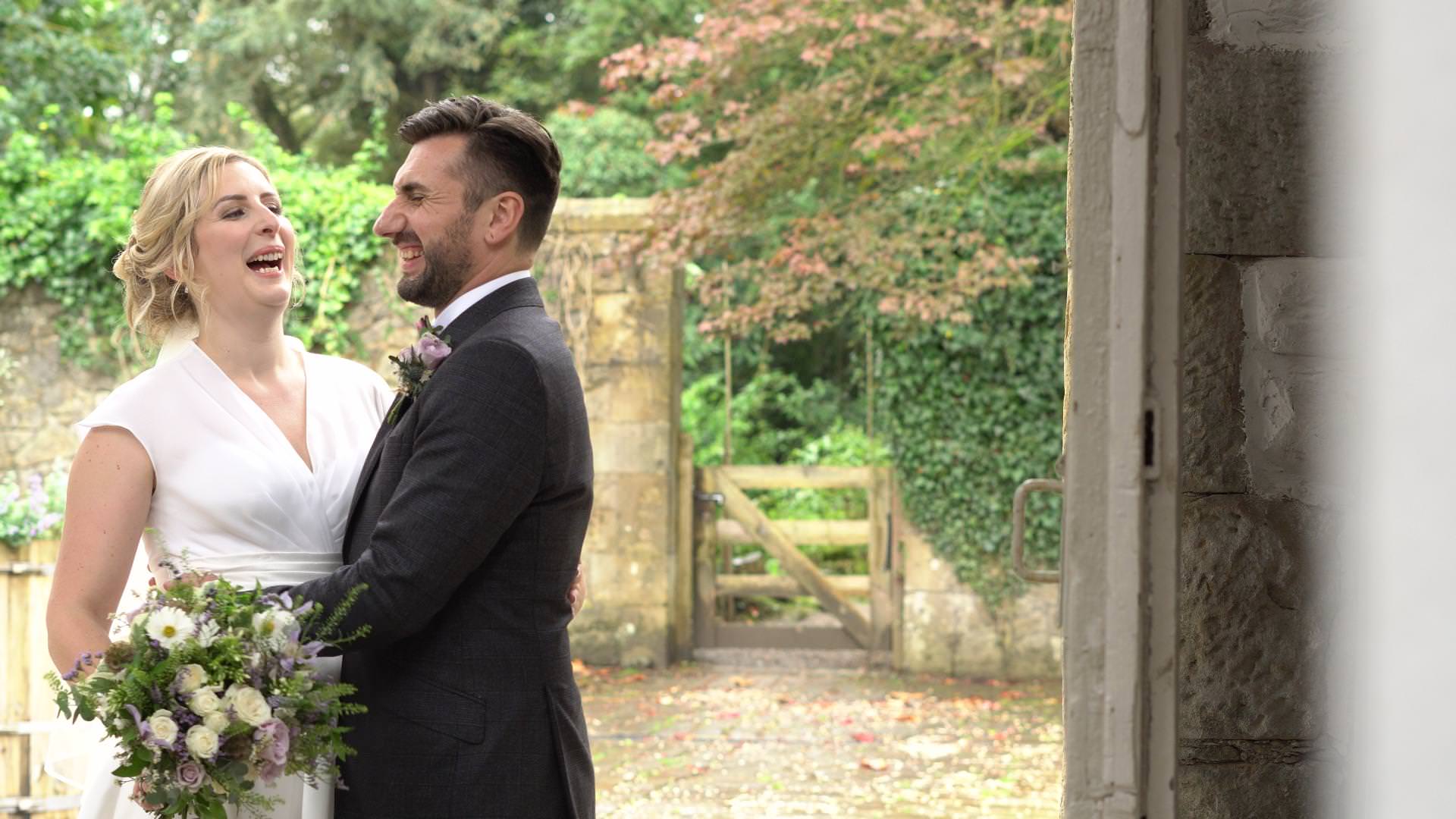 bride and groom laugh during video and photo couple portraits