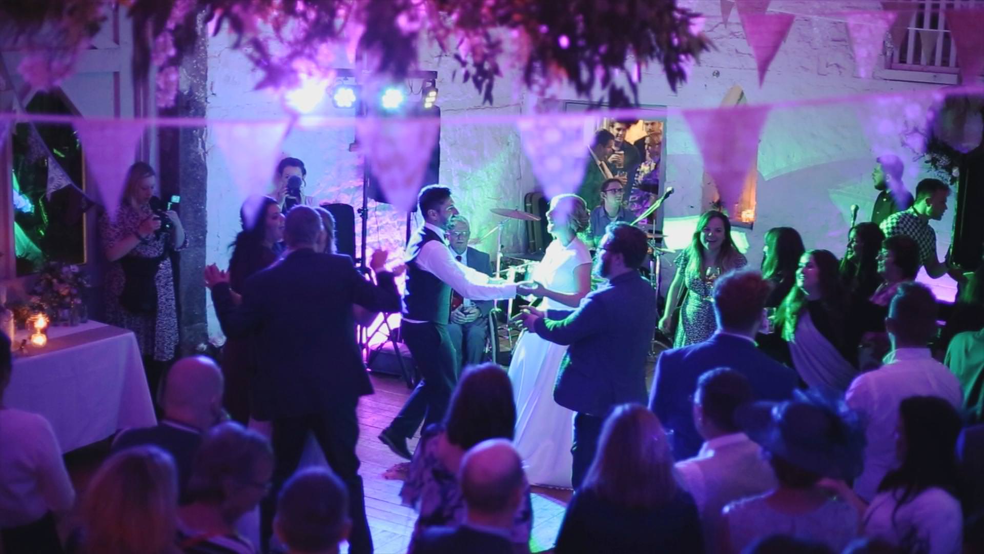 bride and groom dancing in white barn at Wyresdale