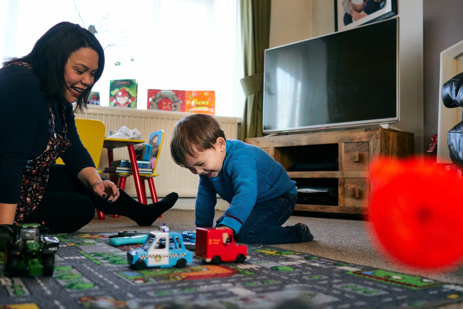mum and son photographed laughing and playing