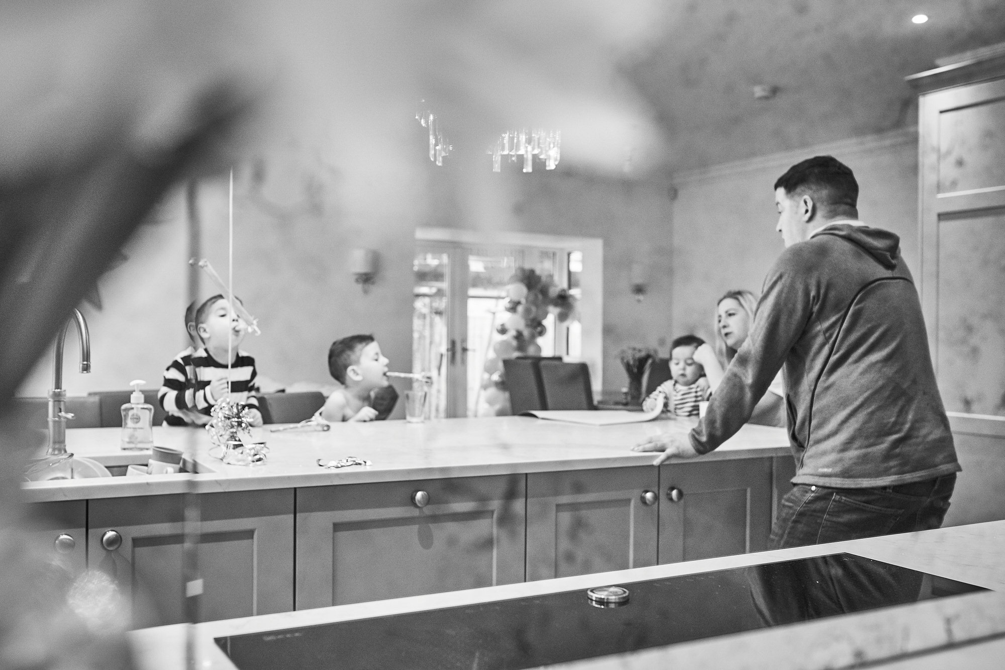 creative and fun photo of family in their kitchen at home