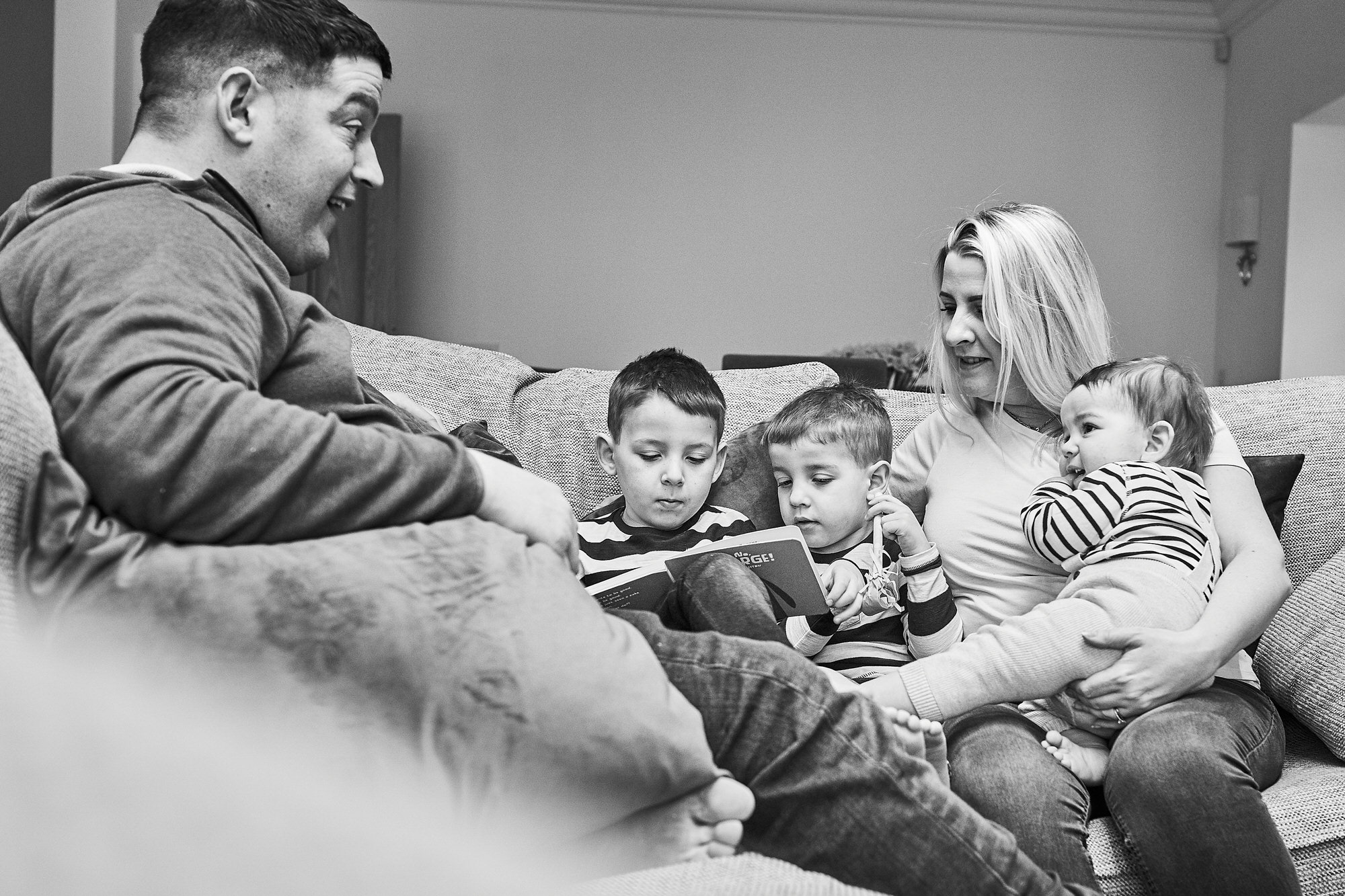 black and white family portrait at home in cheshire