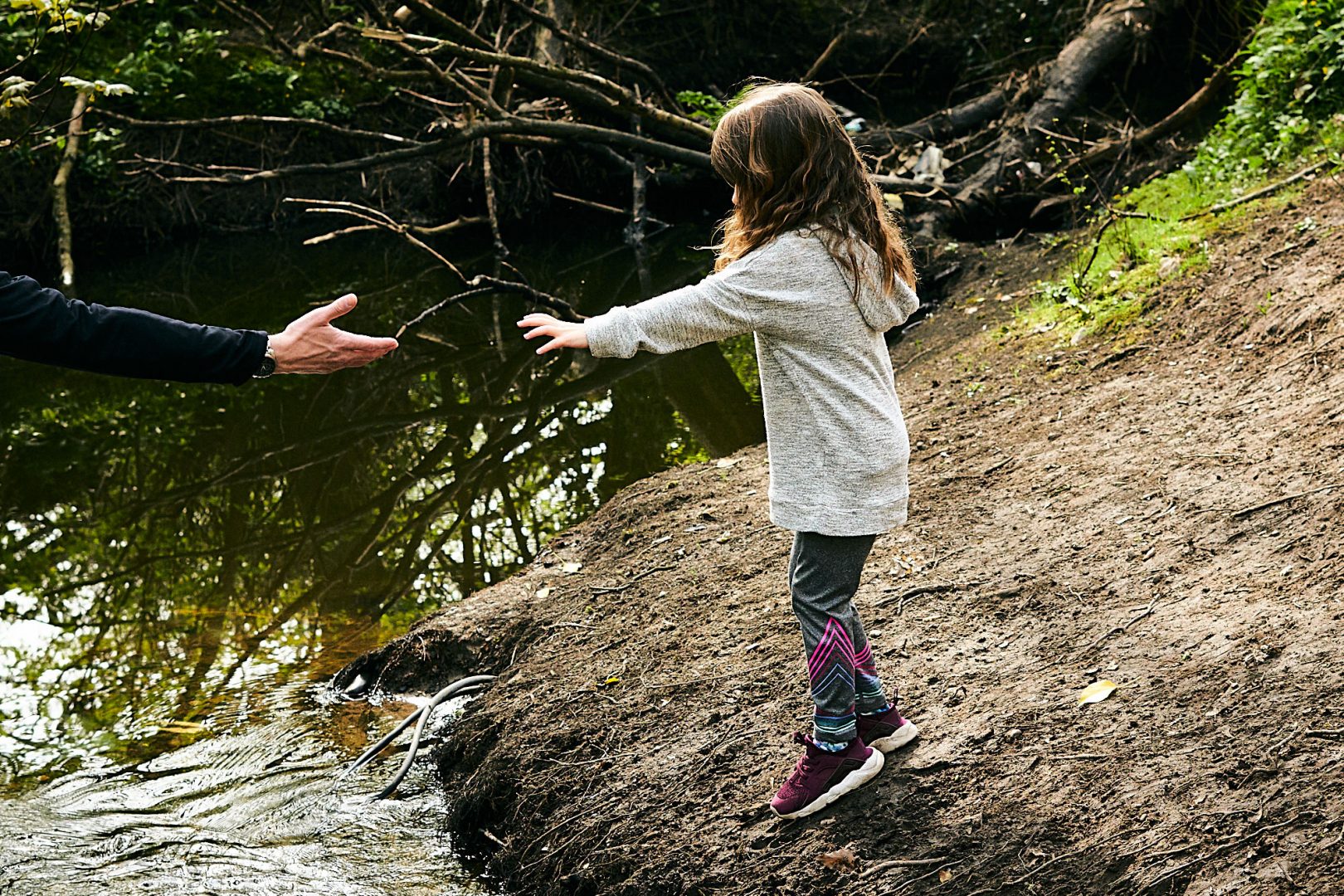 girl reaches out for dads hand in lancashire