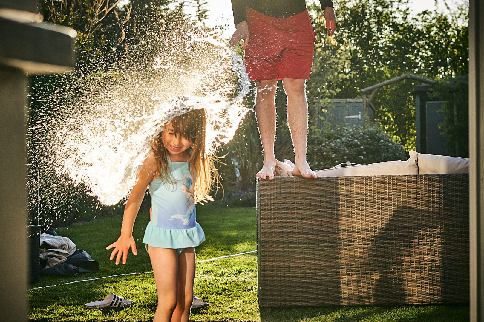 fun action shot of water bomb hitting a girl