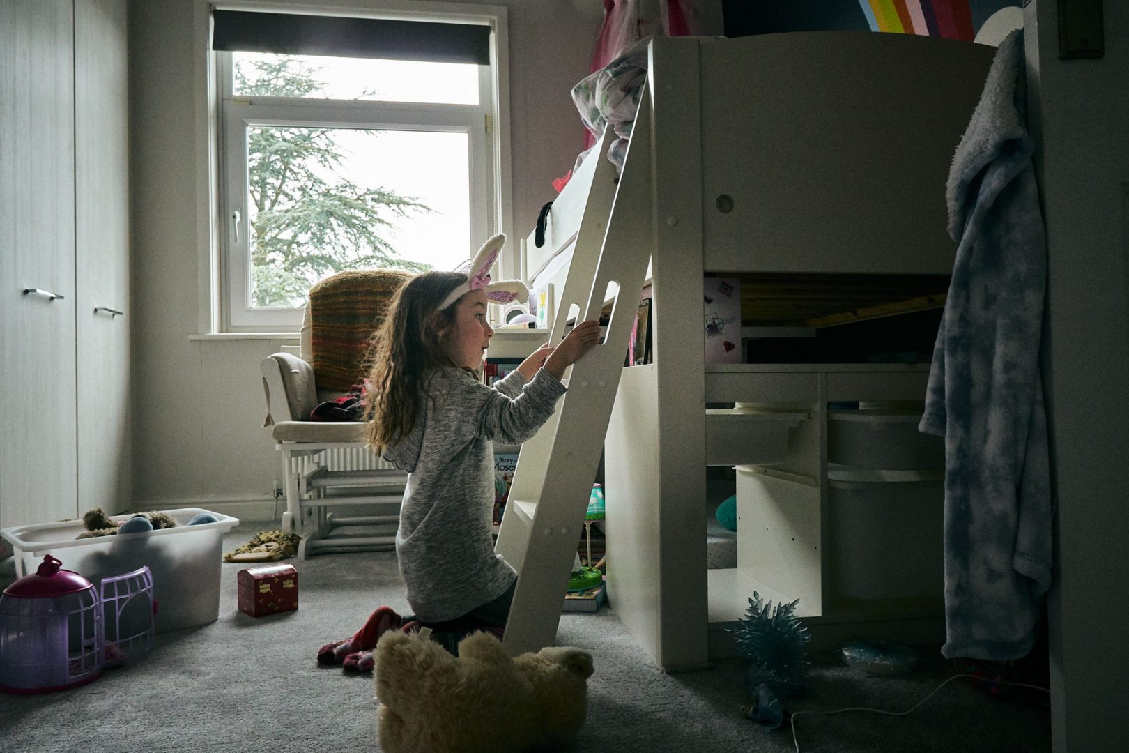 young girl in bedroom having a video call in lockdown