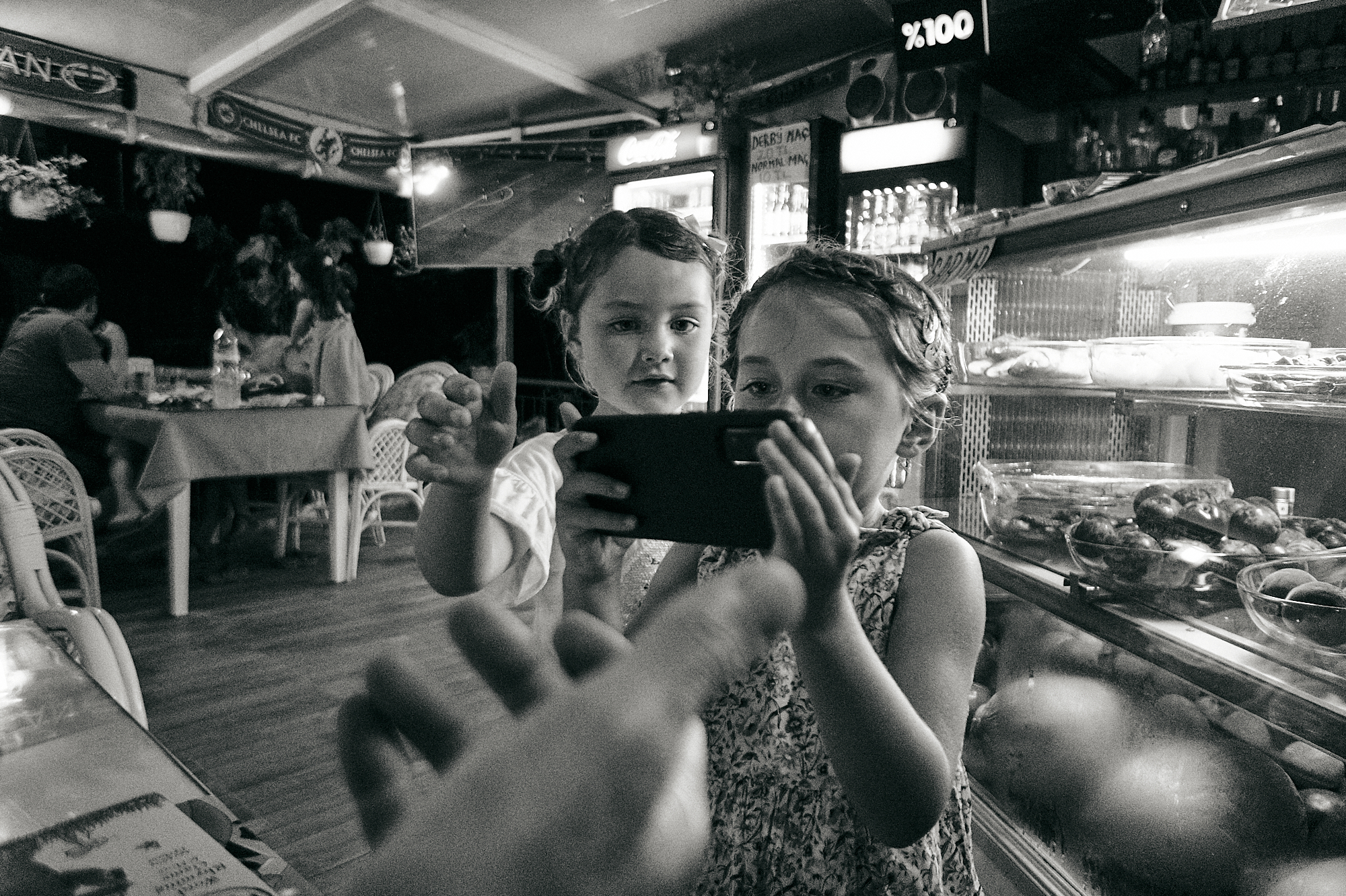 children try to take photo of parents
