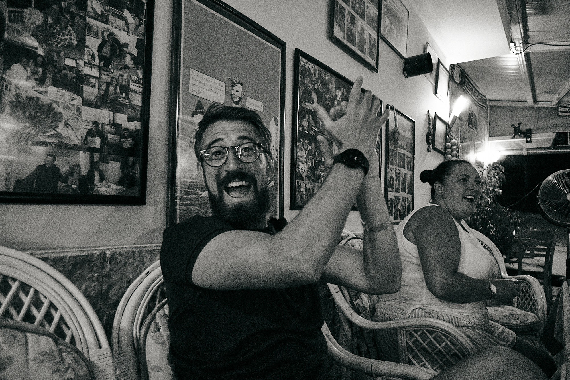 man cheers and applauds as Liverpool win the league on holiday