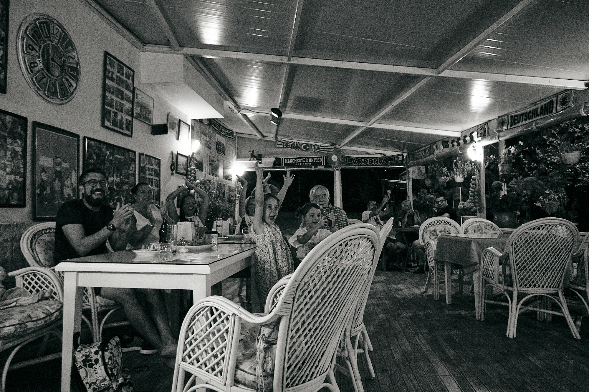group of english tourists cheer at football in Turkish Cafe