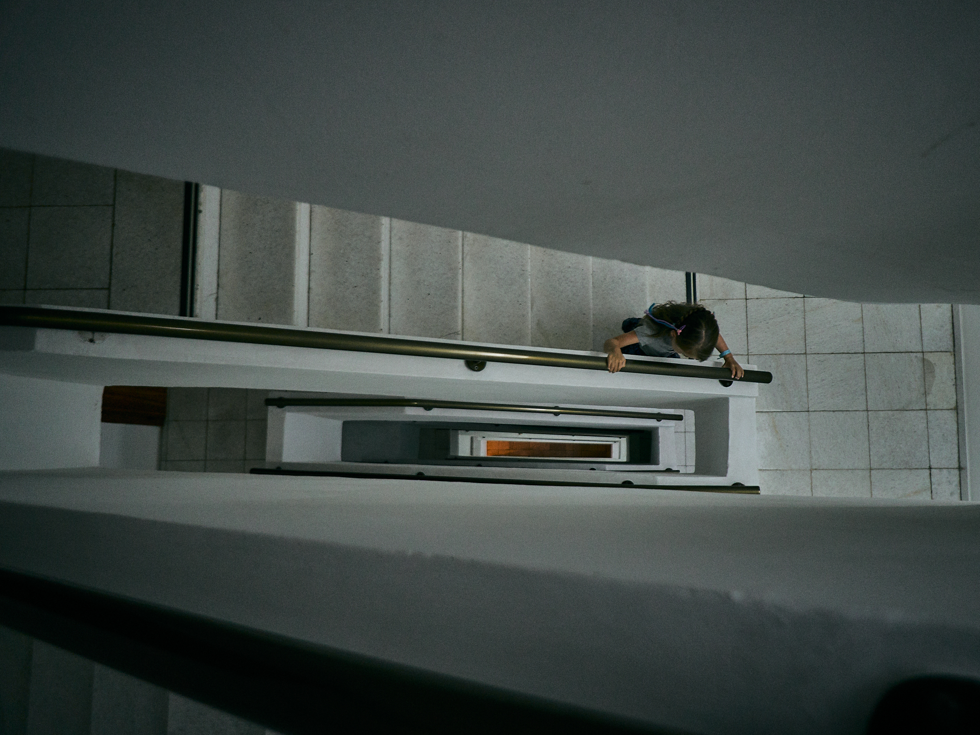 girl walks down empty hotel steps on holiday