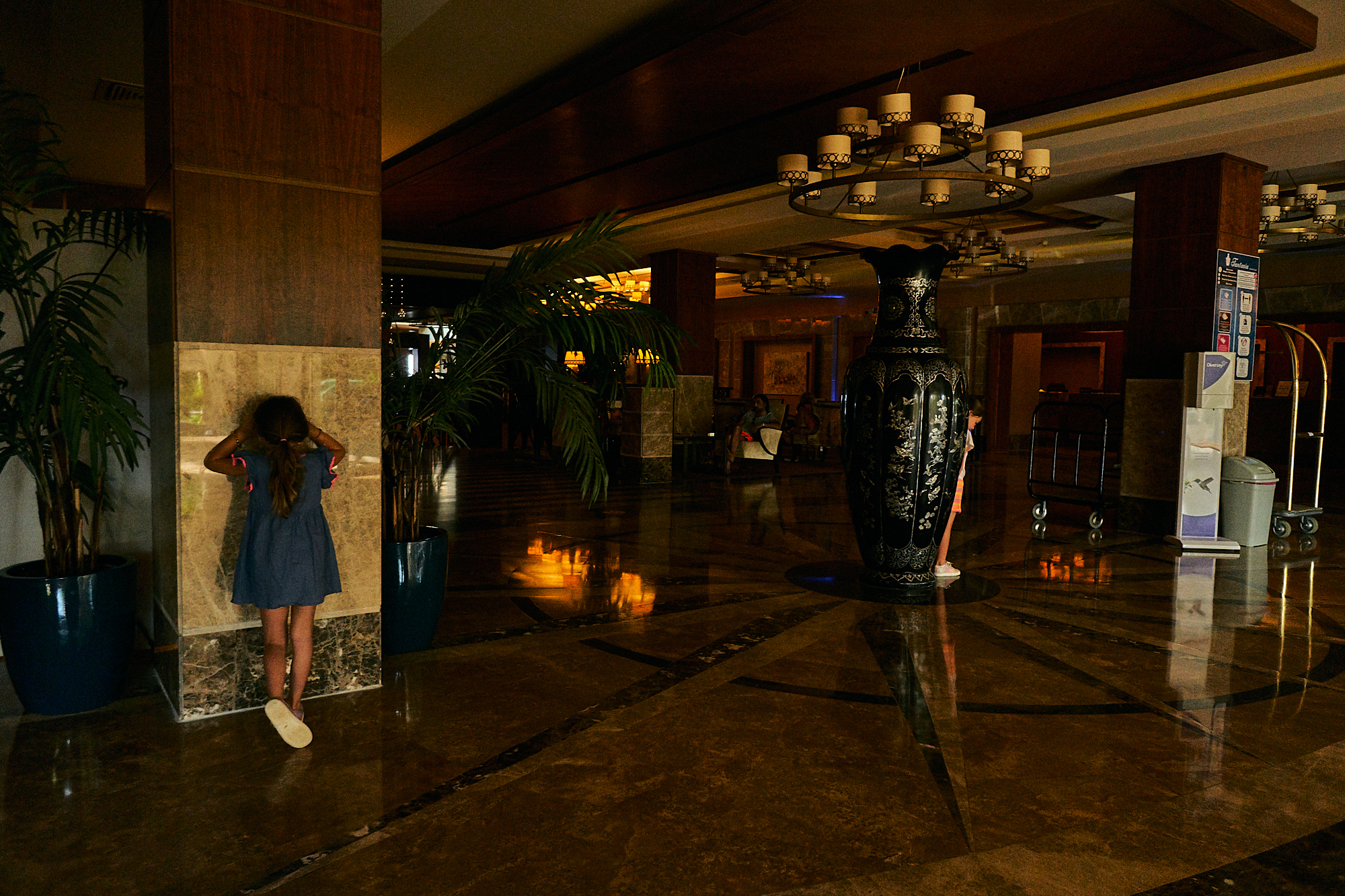 children playing hide and seek in empty hotel during covid19