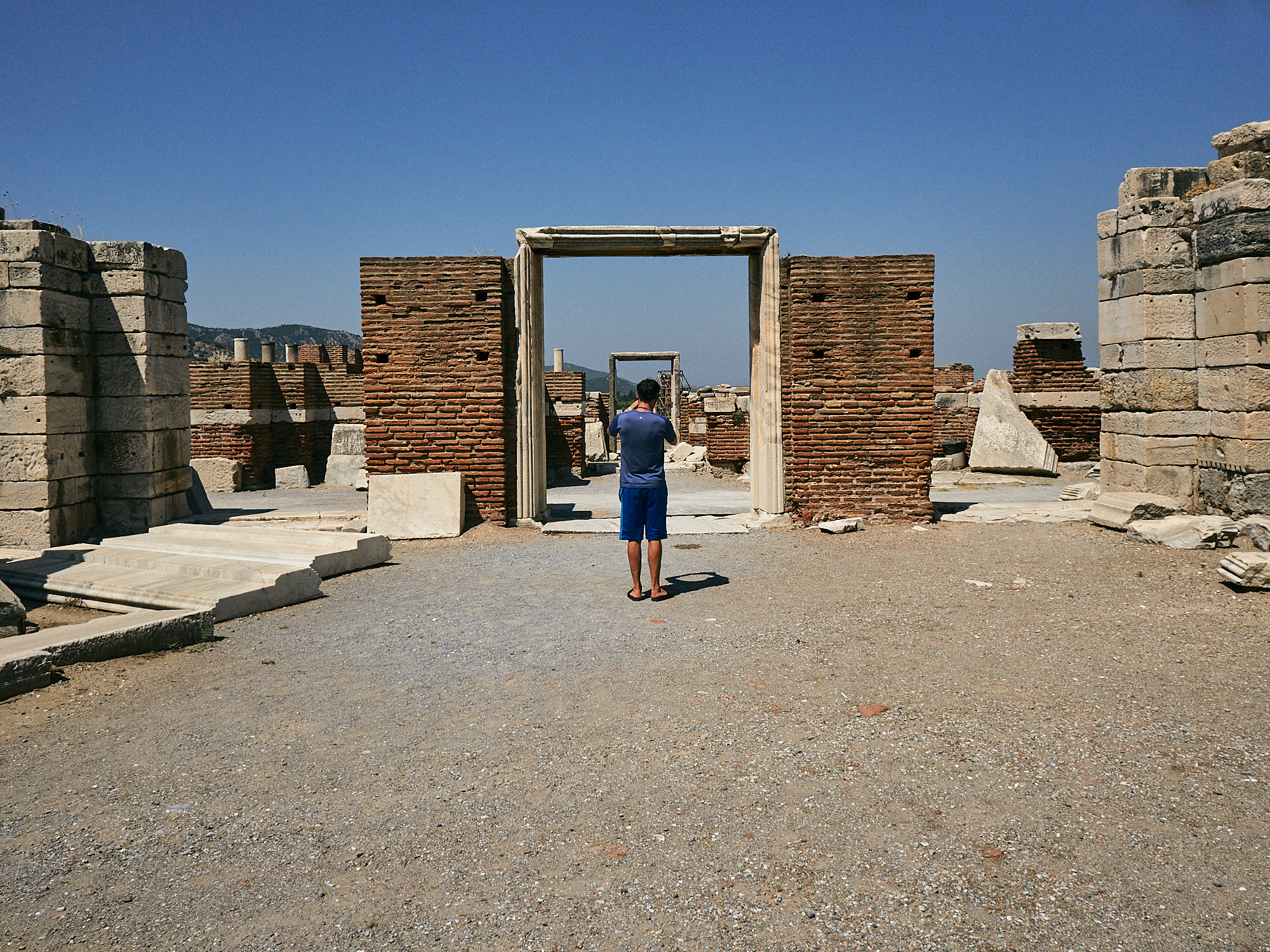 man explores st johns basilica ruins