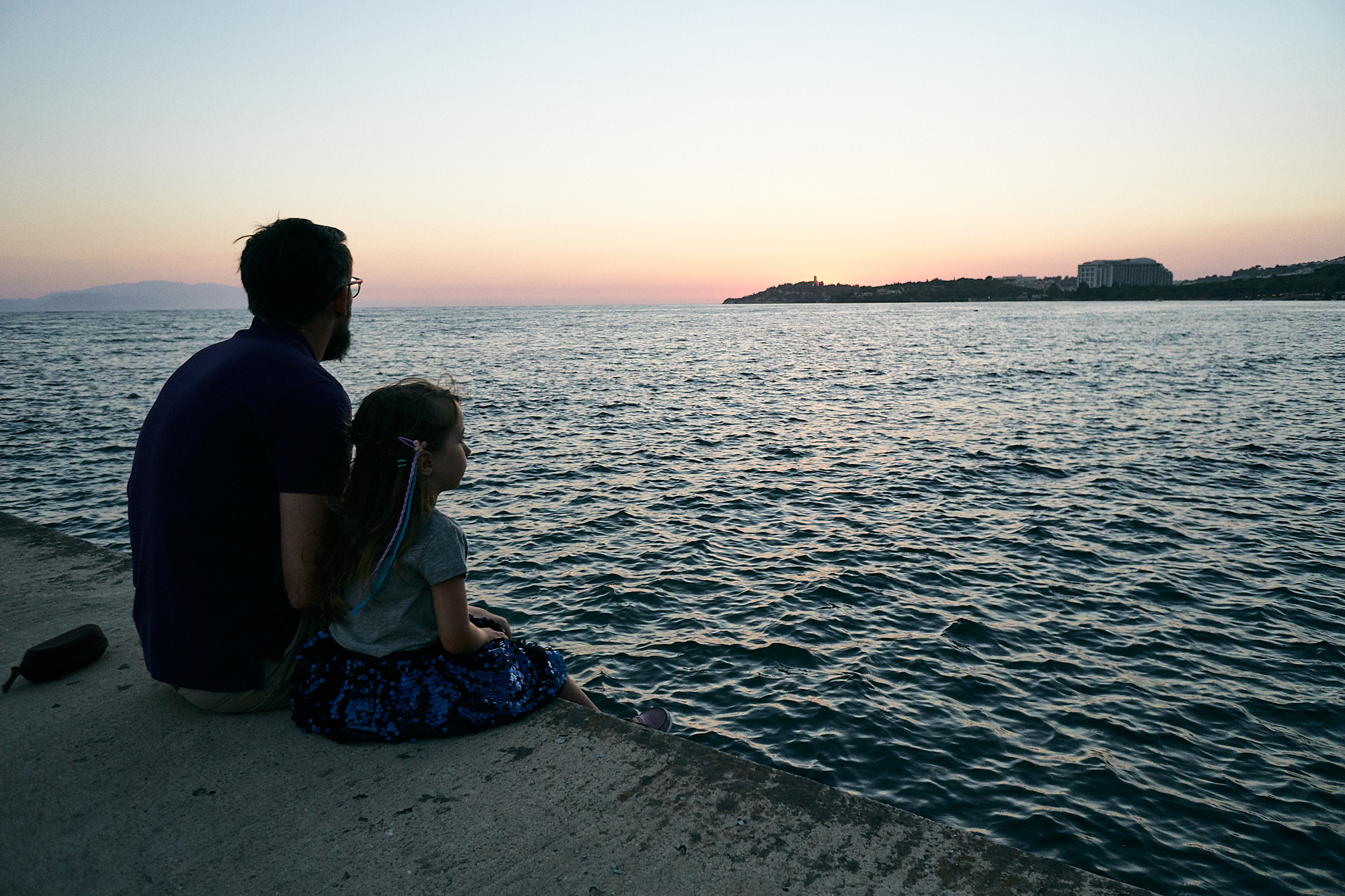 dad and daughter watch sunset in Kusadasi