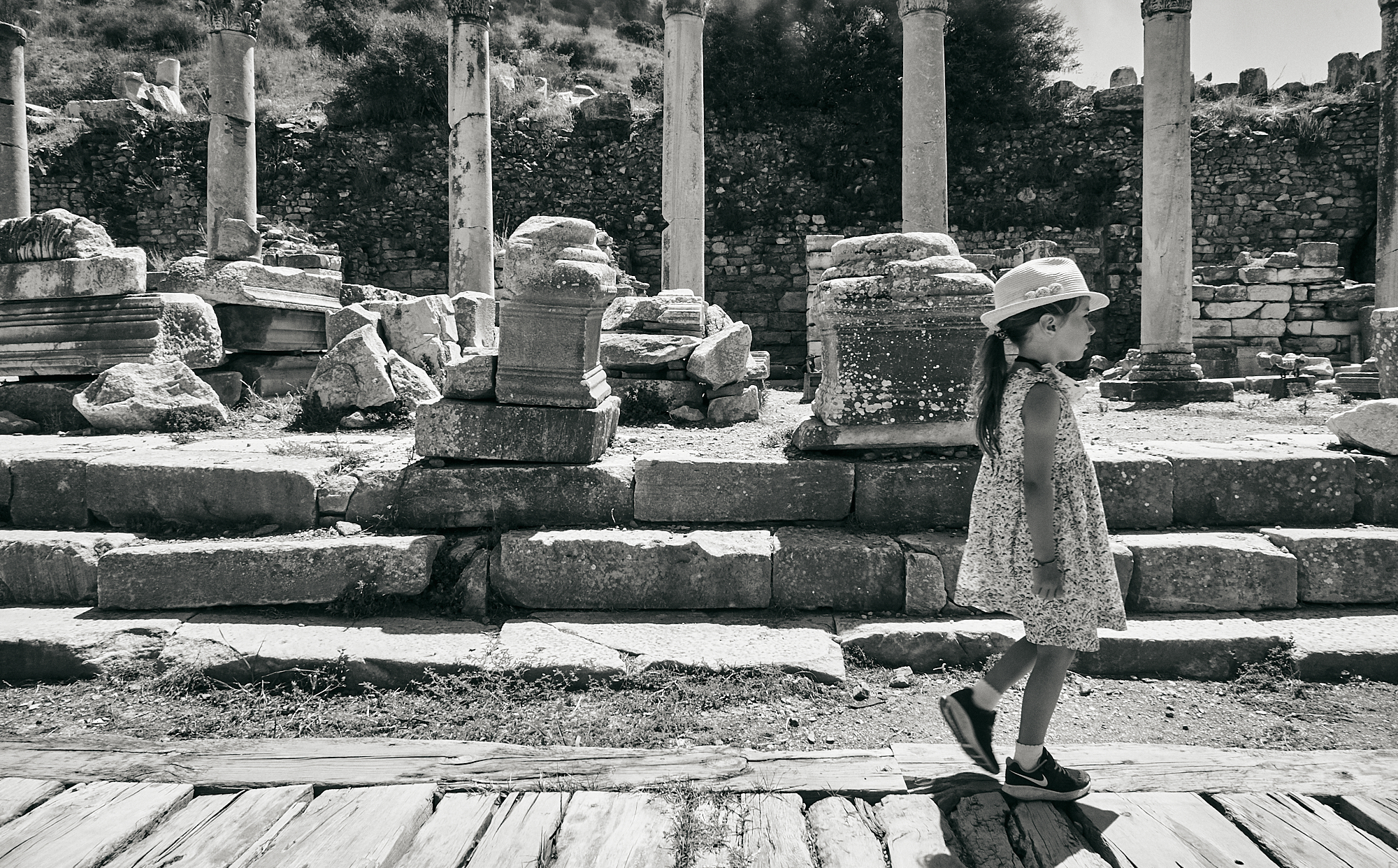girl explores ruins at Ephesus in Turkey